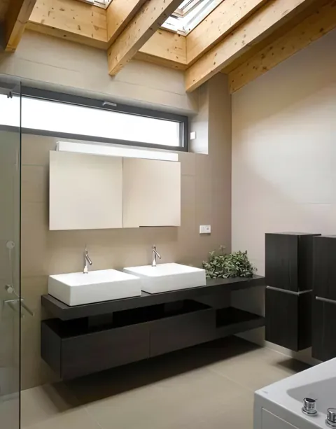 Bathroom vanity with a broad mirror and neutral finishes